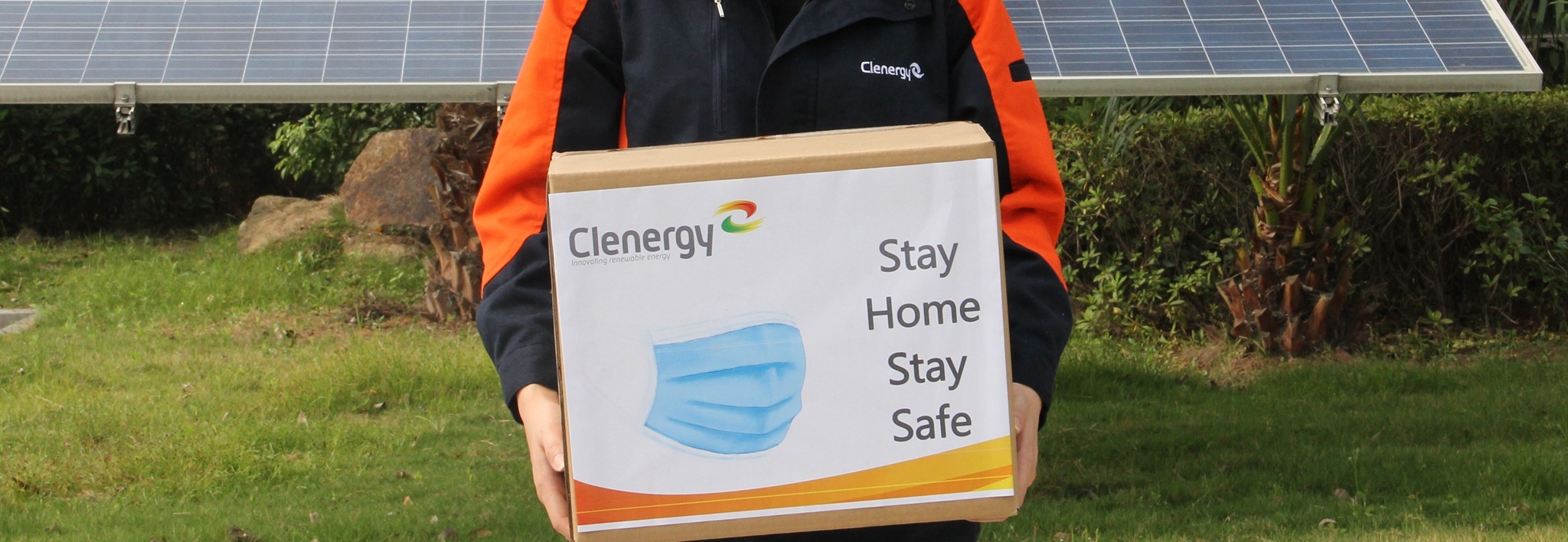 Clenergy Staff Holding a Box Full of Surgical Masks to be Donated in 2020